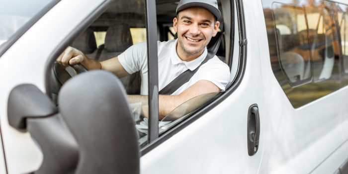 Portrait of delivery driver in the car